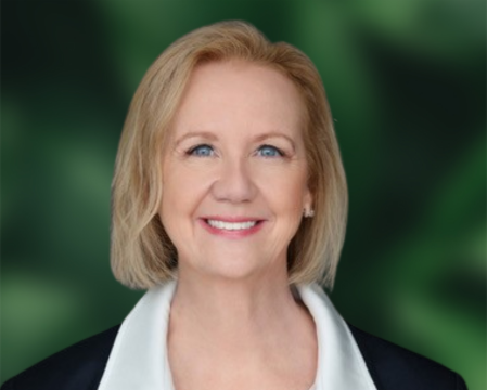 Jill in front of green and black background.